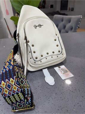 Jessica Simpson White Studded Sling Backpack with Multicolor Woven Strap